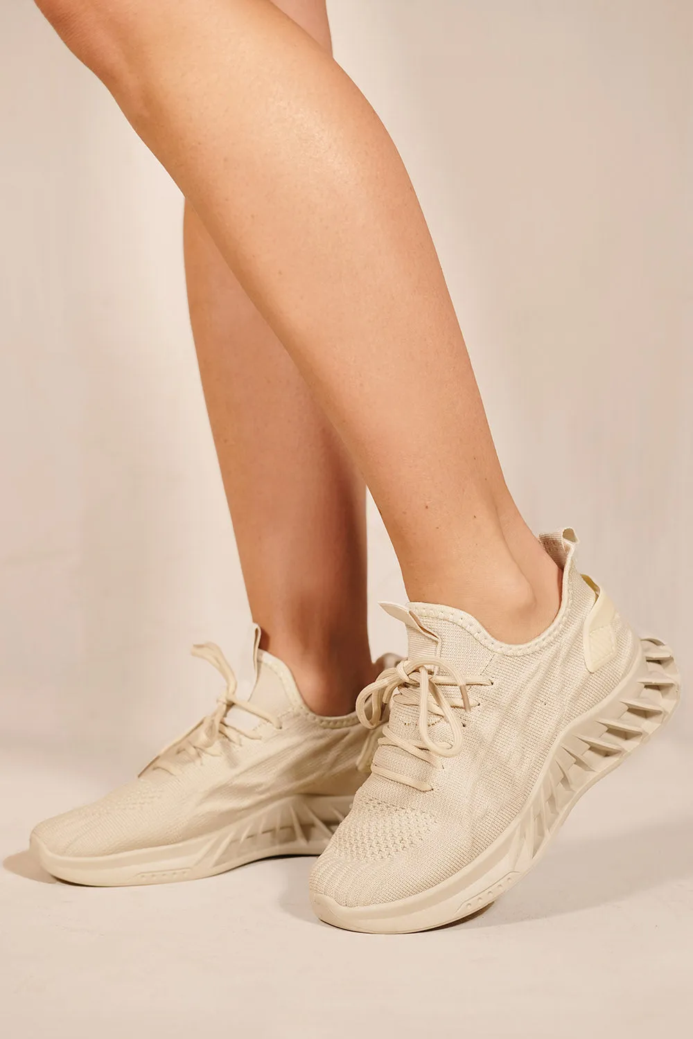 NYMRA PLATFORM RUBBER SOLE KNITTED TRAINERS IN BEIGE